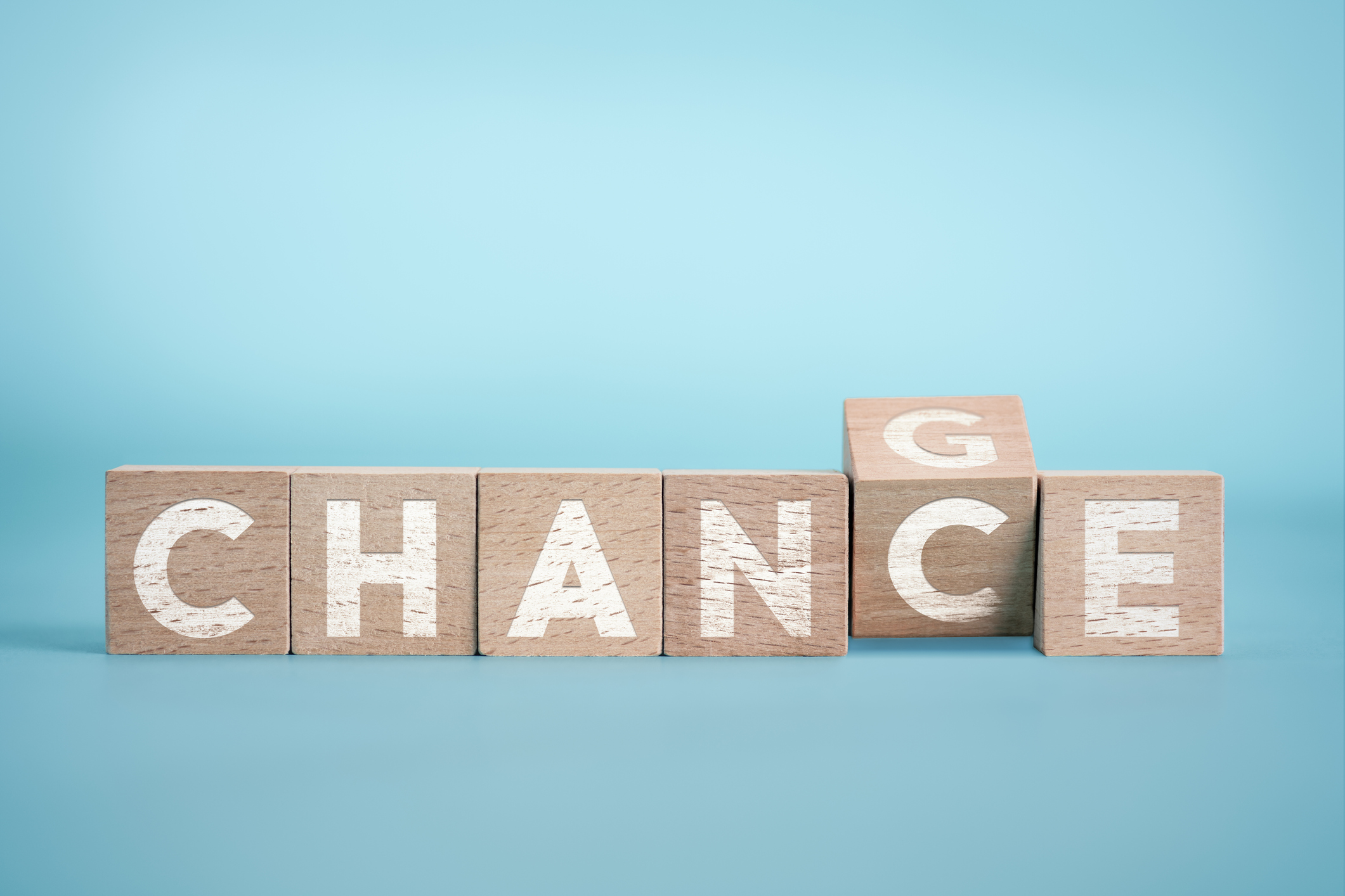 Chance to Change on the Blue Background wiith Wooden Cube